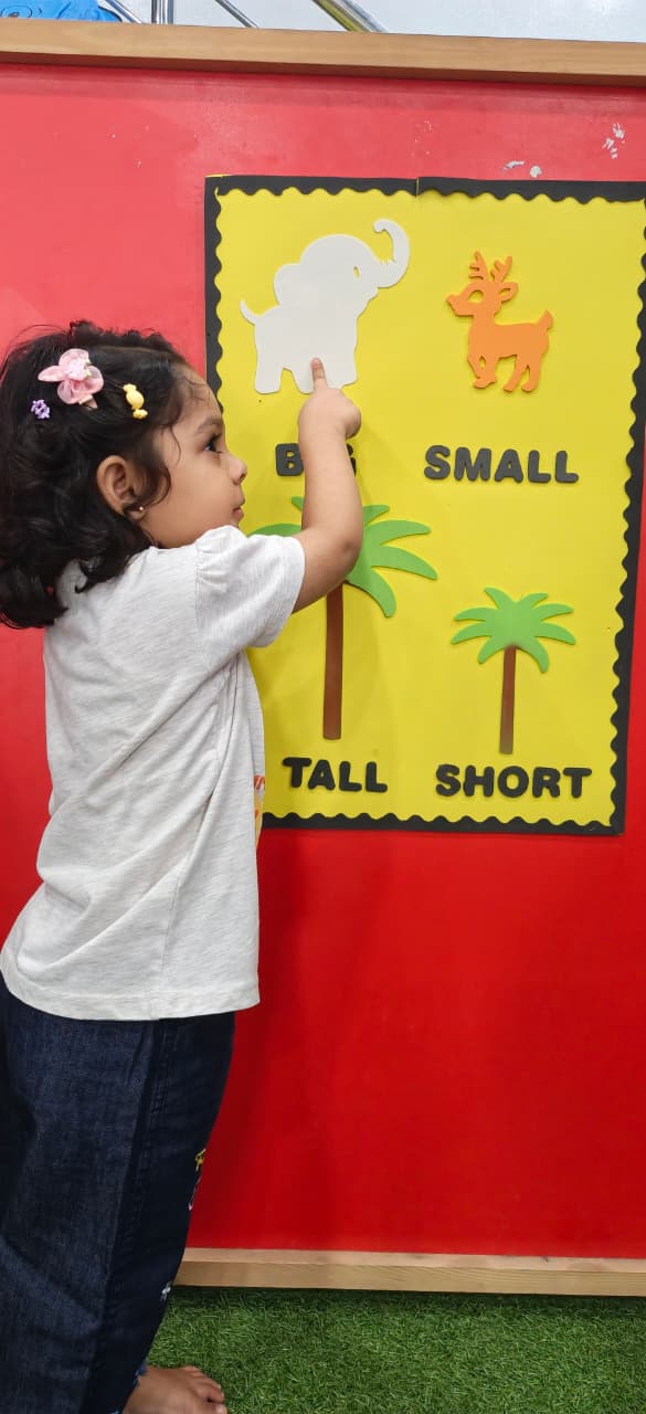 A child exploring colourful building blocks