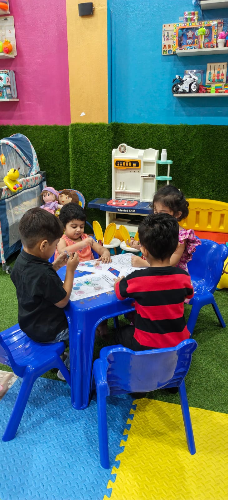 Children learning together at an activity table